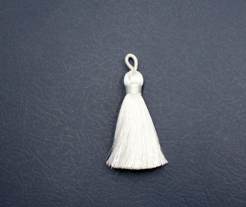 white tassel, silky nylon, 2 inches, sold as 1 piece.